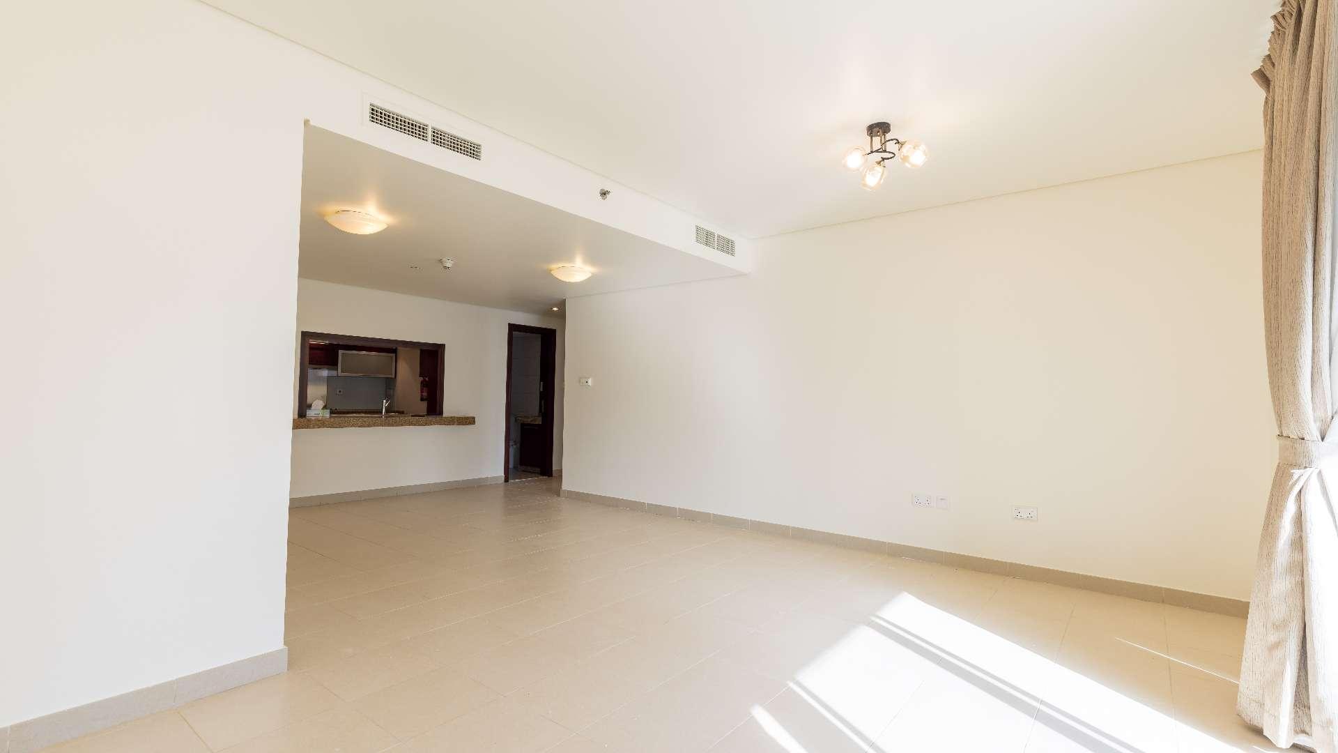Spacious living area in one-bedroom apartment, Burj Views, Downtown Dubai, available for rent