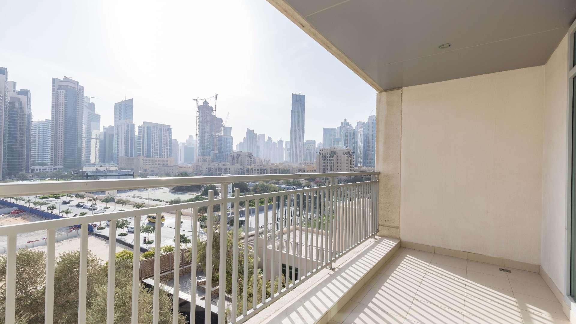 Spacious living room in one-bedroom apartment, Burj Views, Downtown Dubai, large windows, bright interior