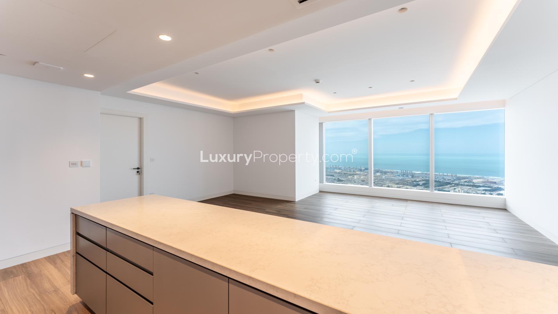 Empty apartment interior with large windows, sea views in Uptown Tower, Jumeirah Lake Towers