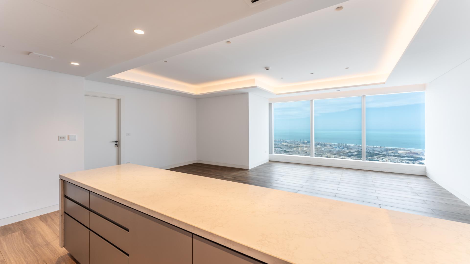 Empty apartment interior with large windows, sea views in Uptown Tower, Jumeirah Lake Towers