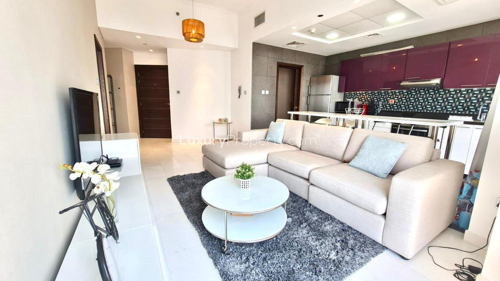 Modern kitchen in 1-bedroom apartment, Cayan Tower, Dubai Marina, with sleek appliances and dining area