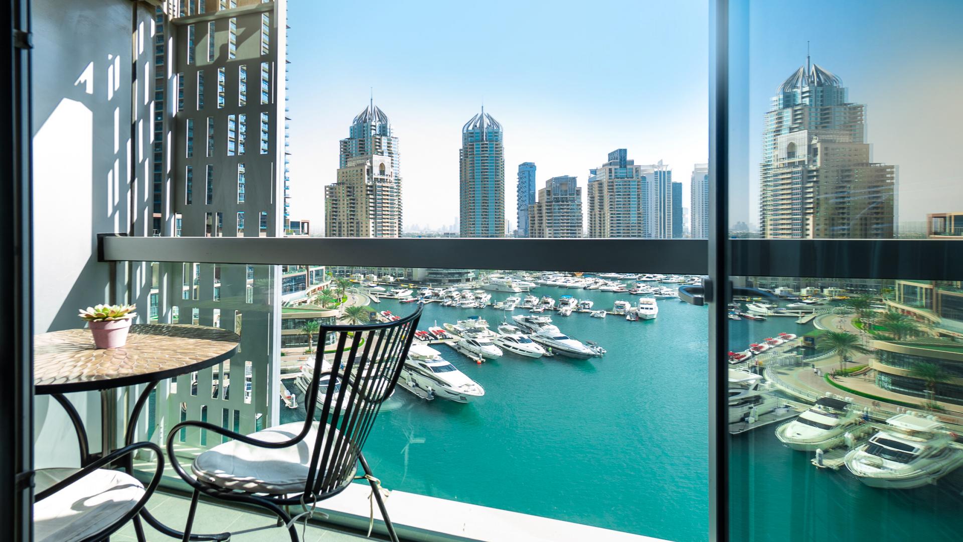 Fully furnished living room in modern Dubai Marina apartment, Cayan Tower, for rent