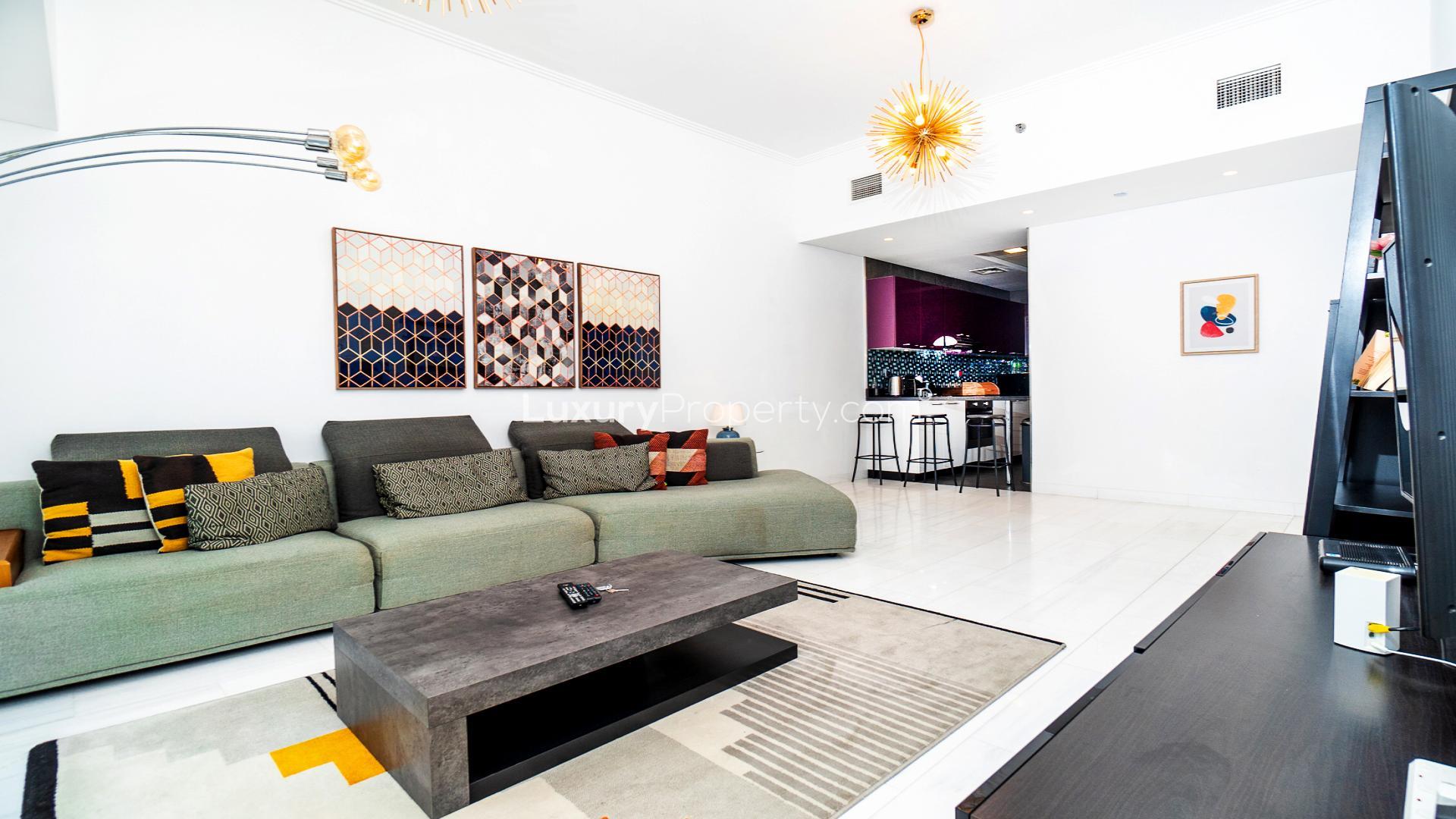 Fully furnished living room with modern decor in Dubai Marina apartment, Cayan Tower