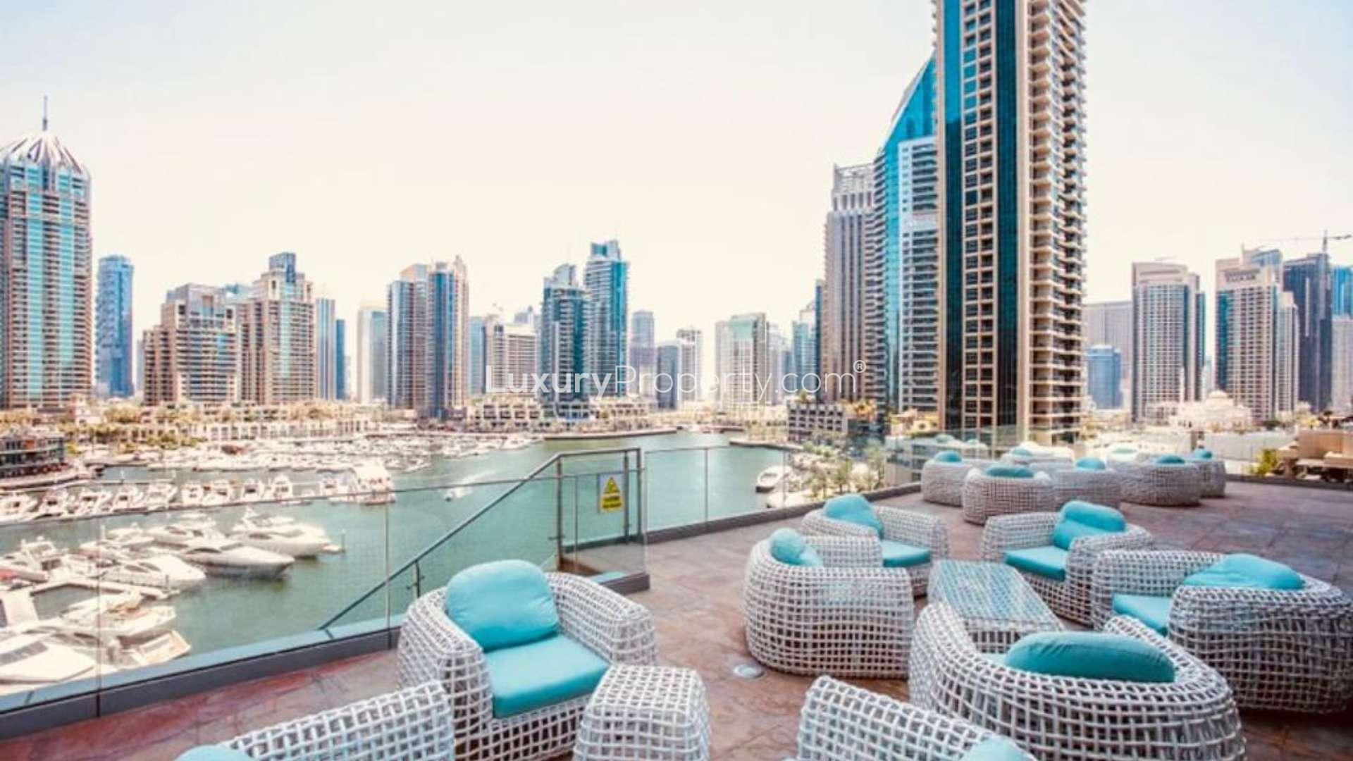 Furnished living area with city view in 1-bedroom apartment, Cayan Tower, Dubai Marina