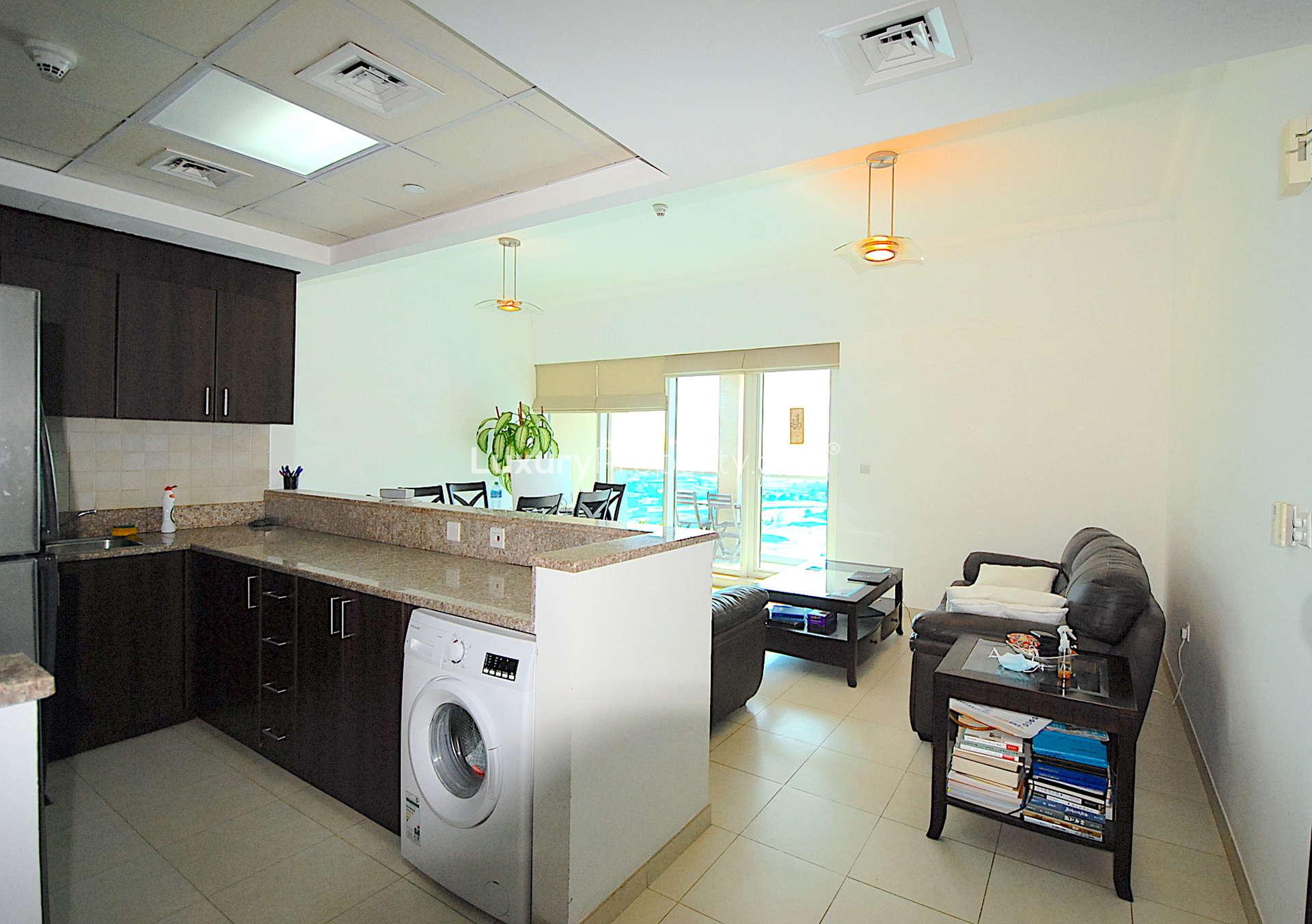 One-bedroom apartment interior in Churchill Towers, Business Bay, featuring a bright, modern design