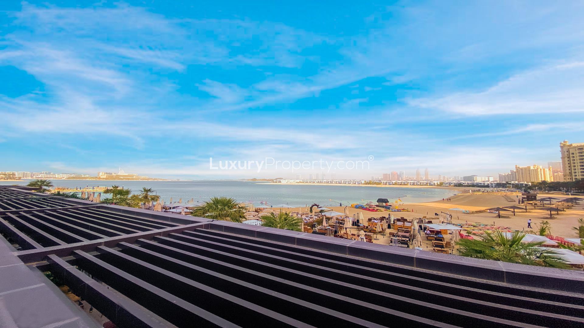 Beachfront studio balcony with seating at Club Vista Mare, Palm Jumeirah, for rent