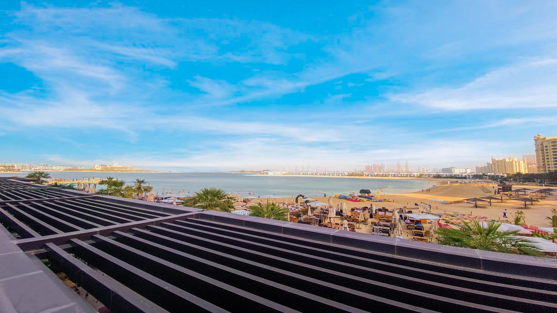 Beachfront studio balcony with seating at Club Vista Mare, Palm Jumeirah, for rent