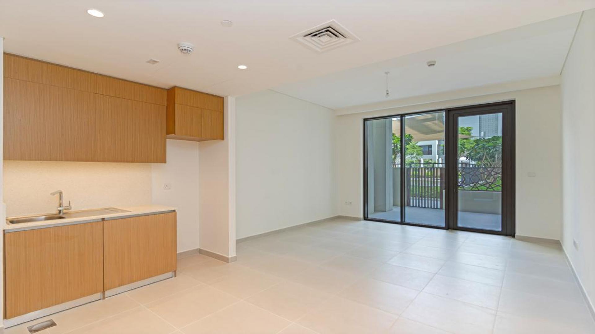 Brand new apartment interior in Dubai Creek Harbour, open-plan living and kitchen area