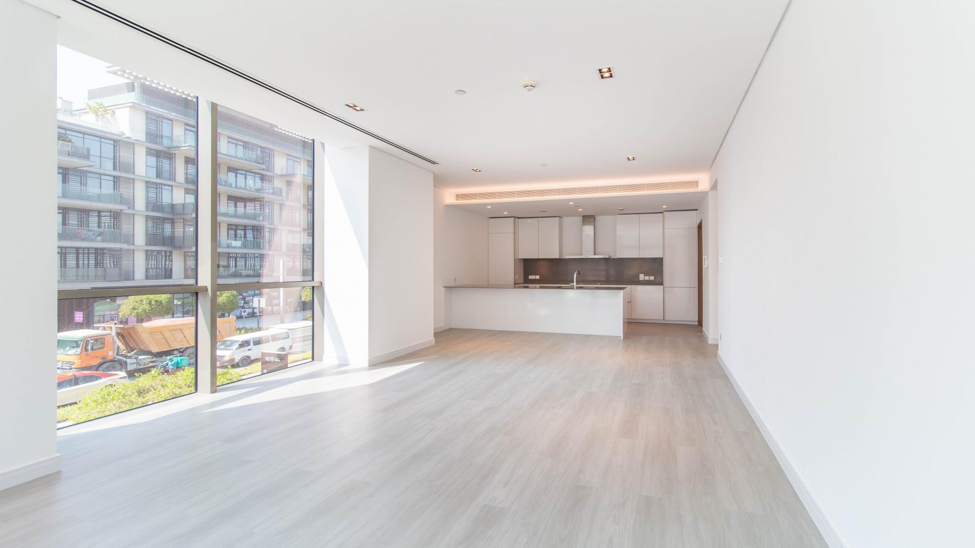 Bright, spacious living area in City Walk apartment, large windows with city views