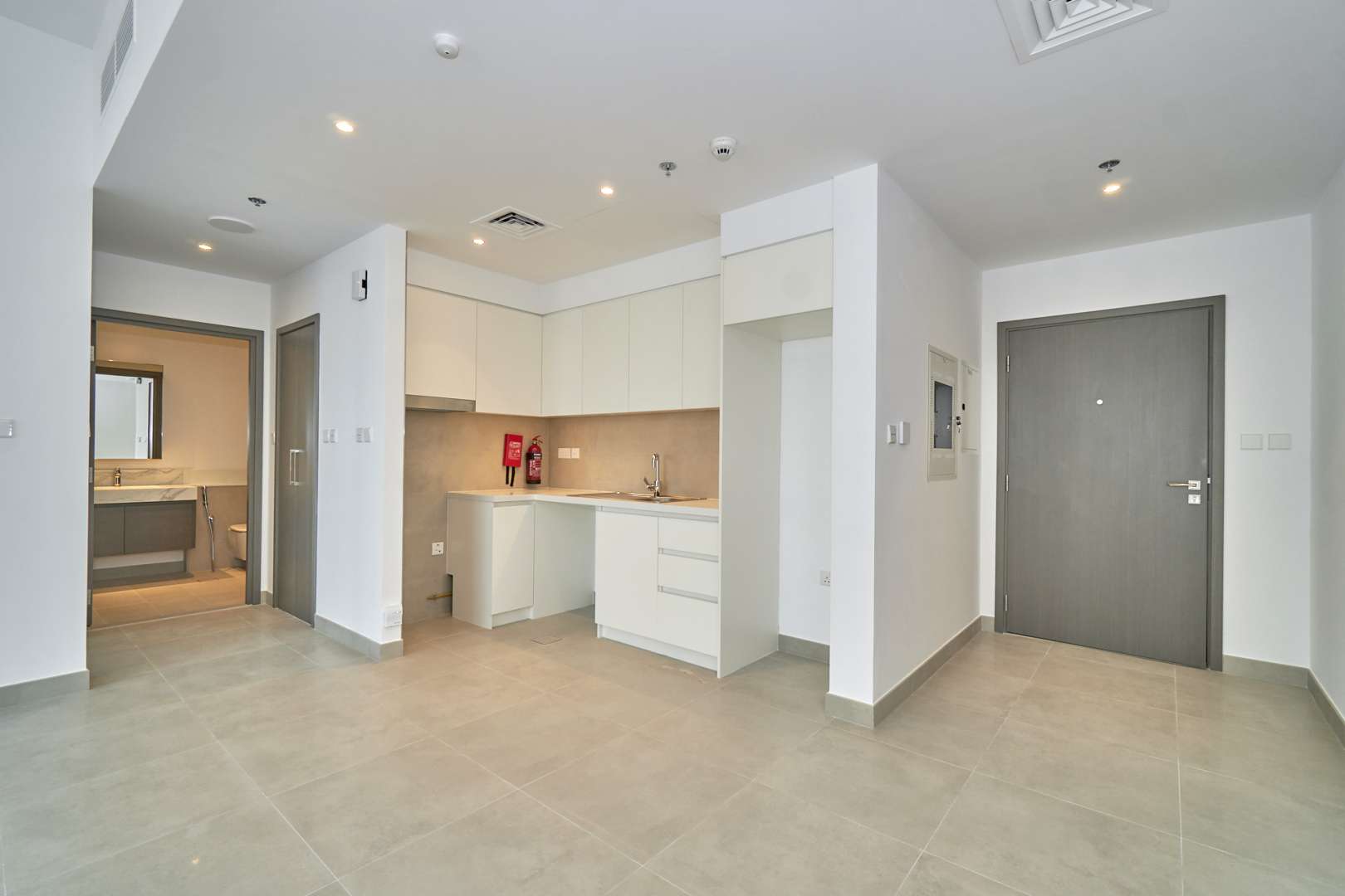 Modern kitchen and living area in one-bedroom apartment, Creek Horizon, Dubai Creek Harbour