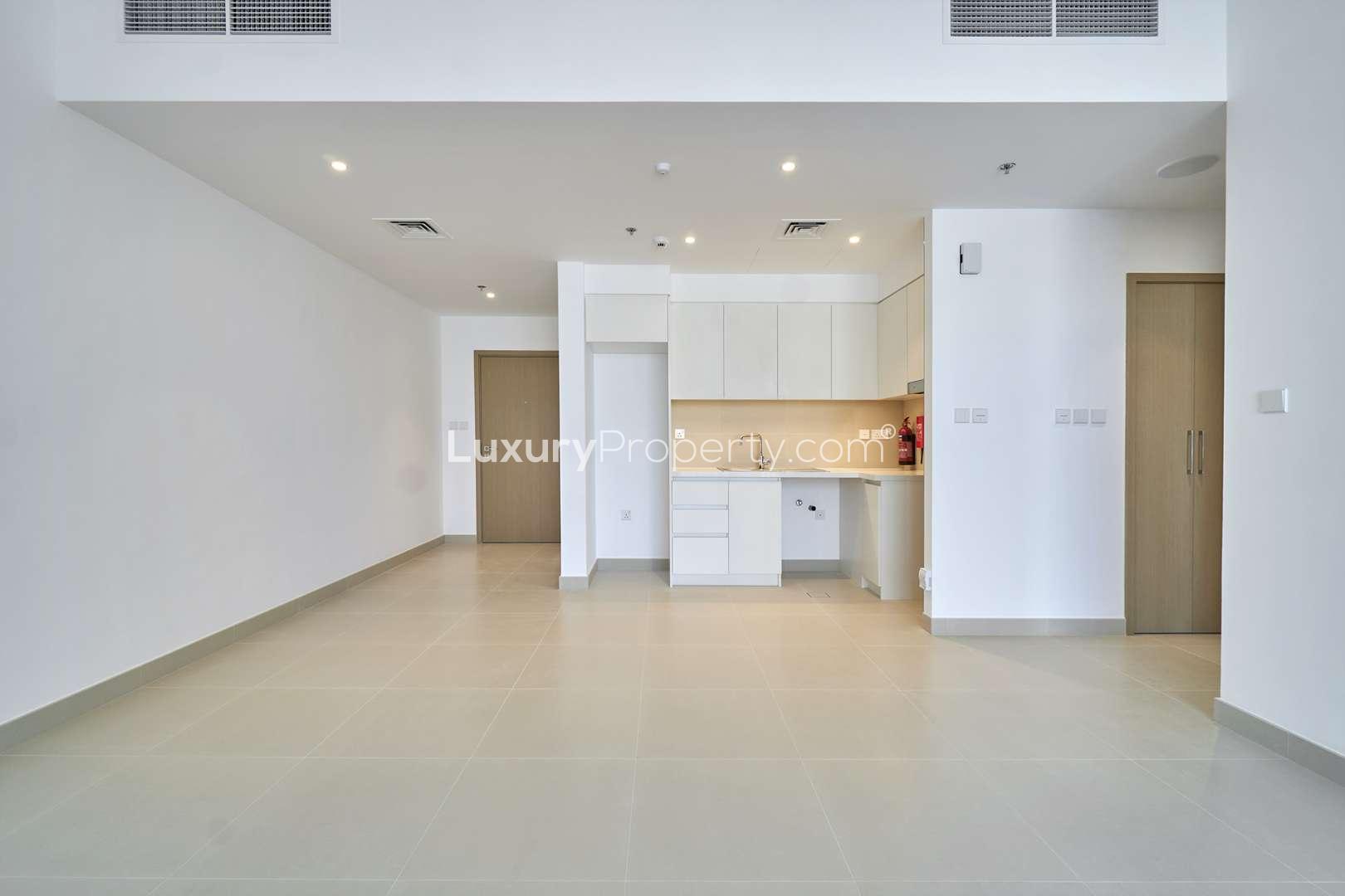 Modern kitchen and living area in Dubai Creek Harbour apartment for rent, Creek Horizon