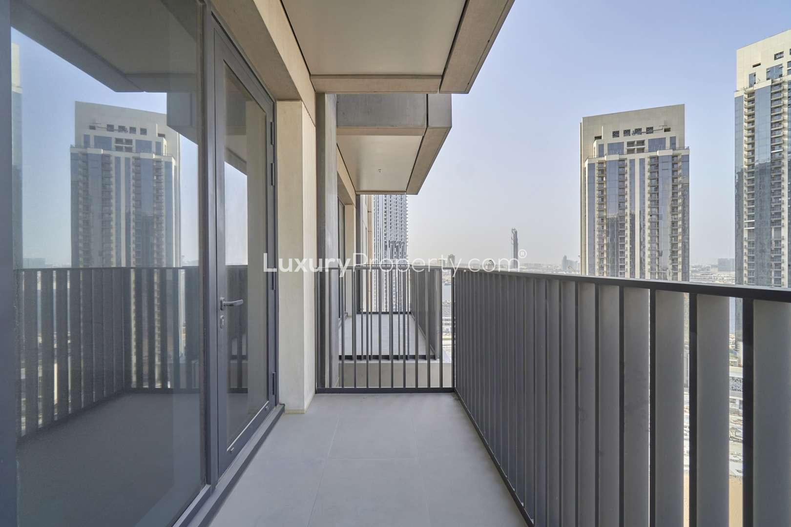 Balcony view from 1-bedroom apartment in Creek Horizon, Dubai Creek Harbour, showcasing modern architecture
