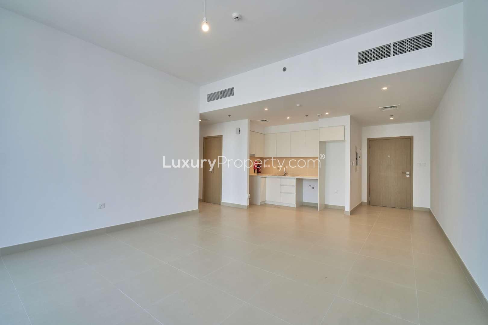 Balcony view from 1-bedroom apartment in Creek Horizon, Dubai Creek Harbour, overlooking water and skyline