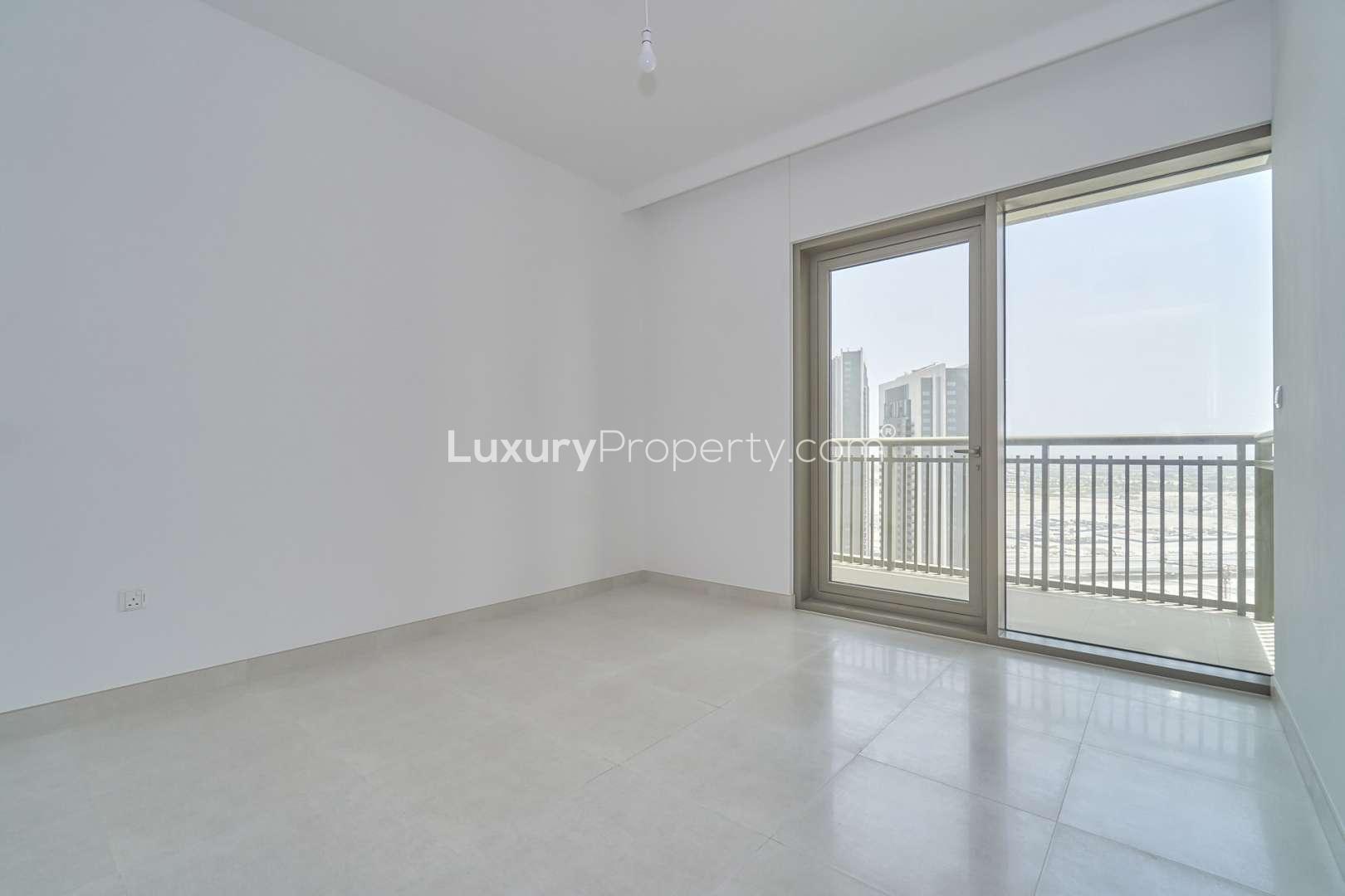 Bright living room with large windows in Creekside 18 B apartment, Dubai Creek Harbour