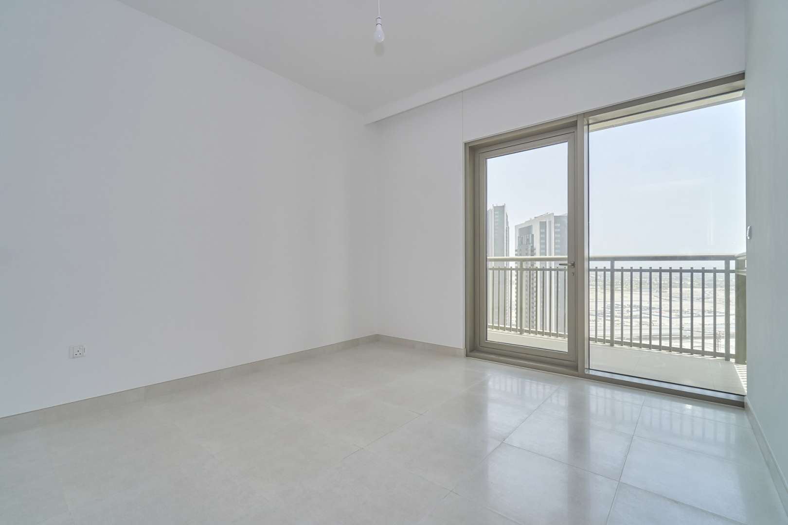 Bright living room with large windows in Creekside 18 B apartment, Dubai Creek Harbour