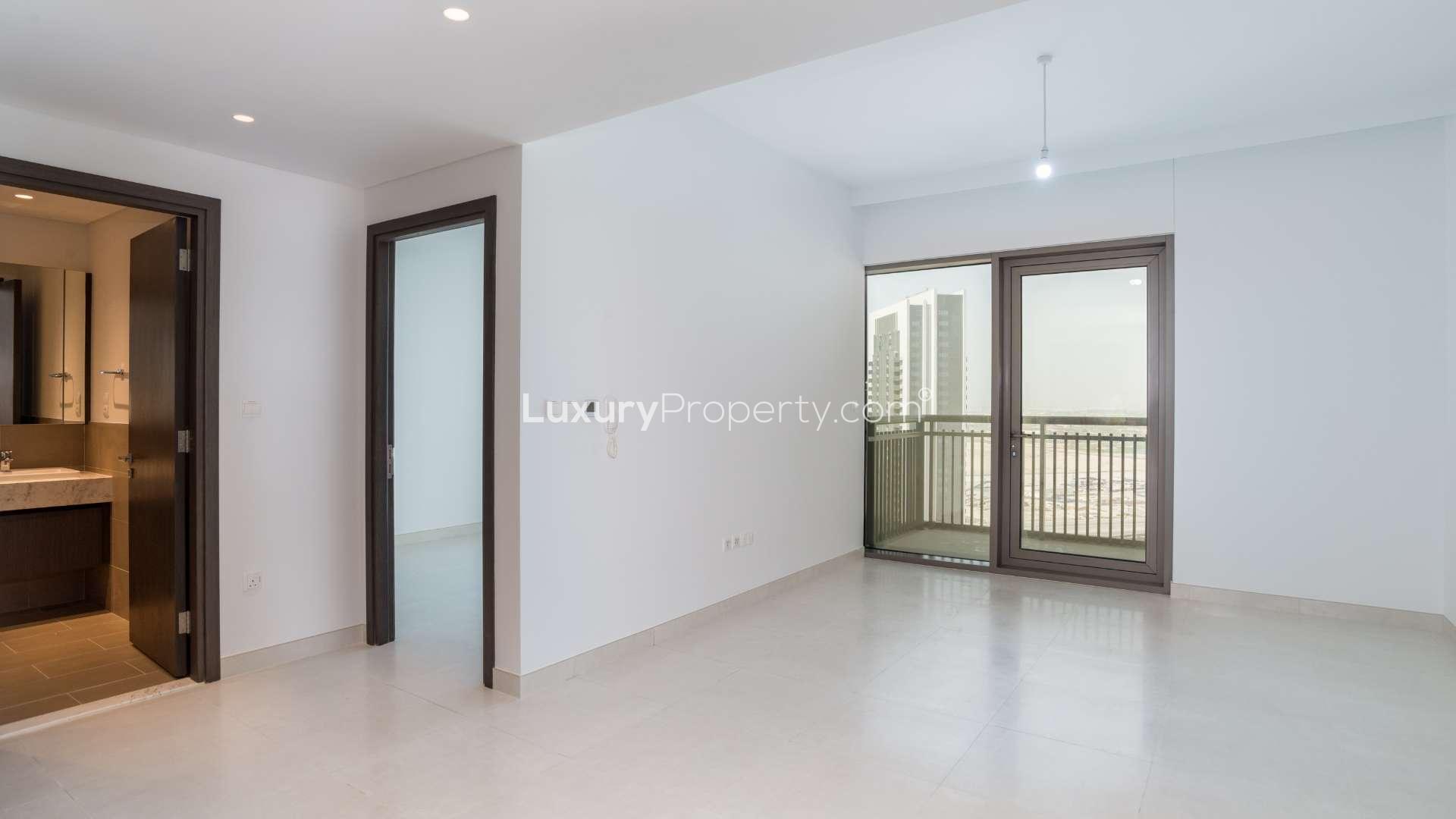 Contemporary kitchen and living area in 1-bedroom apartment, Creekside 18, Dubai Creek Harbour