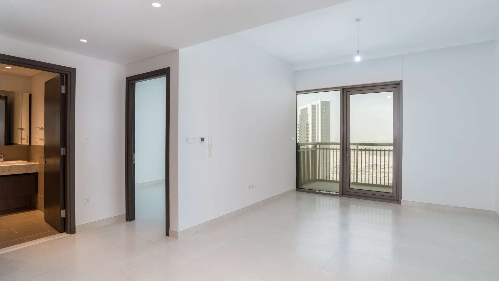 Contemporary kitchen and living area in 1-bedroom apartment, Creekside 18, Dubai Creek Harbour