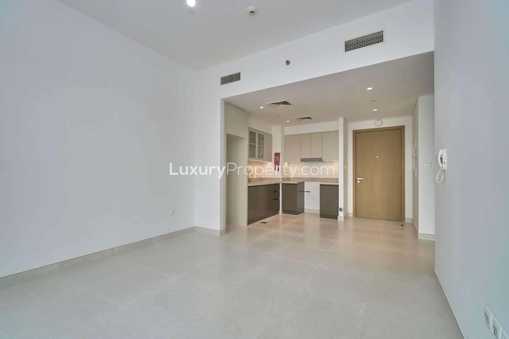Empty living area and kitchen in 1-bedroom apartment, Creekside 18, Dubai Creek Harbour