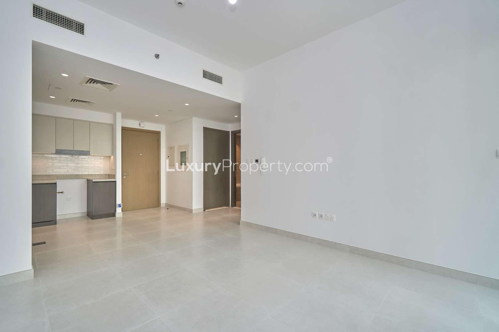 Empty living area in 1-bedroom Creekside 18 apartment, Dubai Creek Harbour, with modern finishes