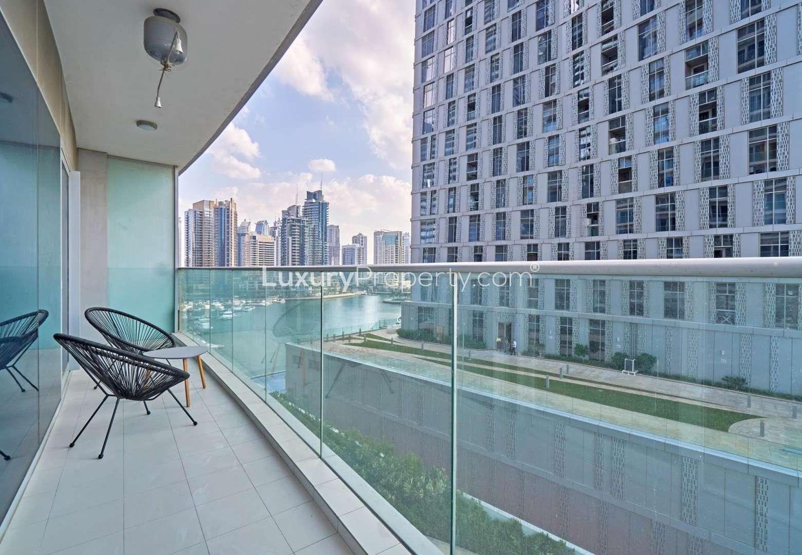 Furnished living room in 1-bedroom apartment, DAMAC Residenze, Dubai Marina, with balcony view