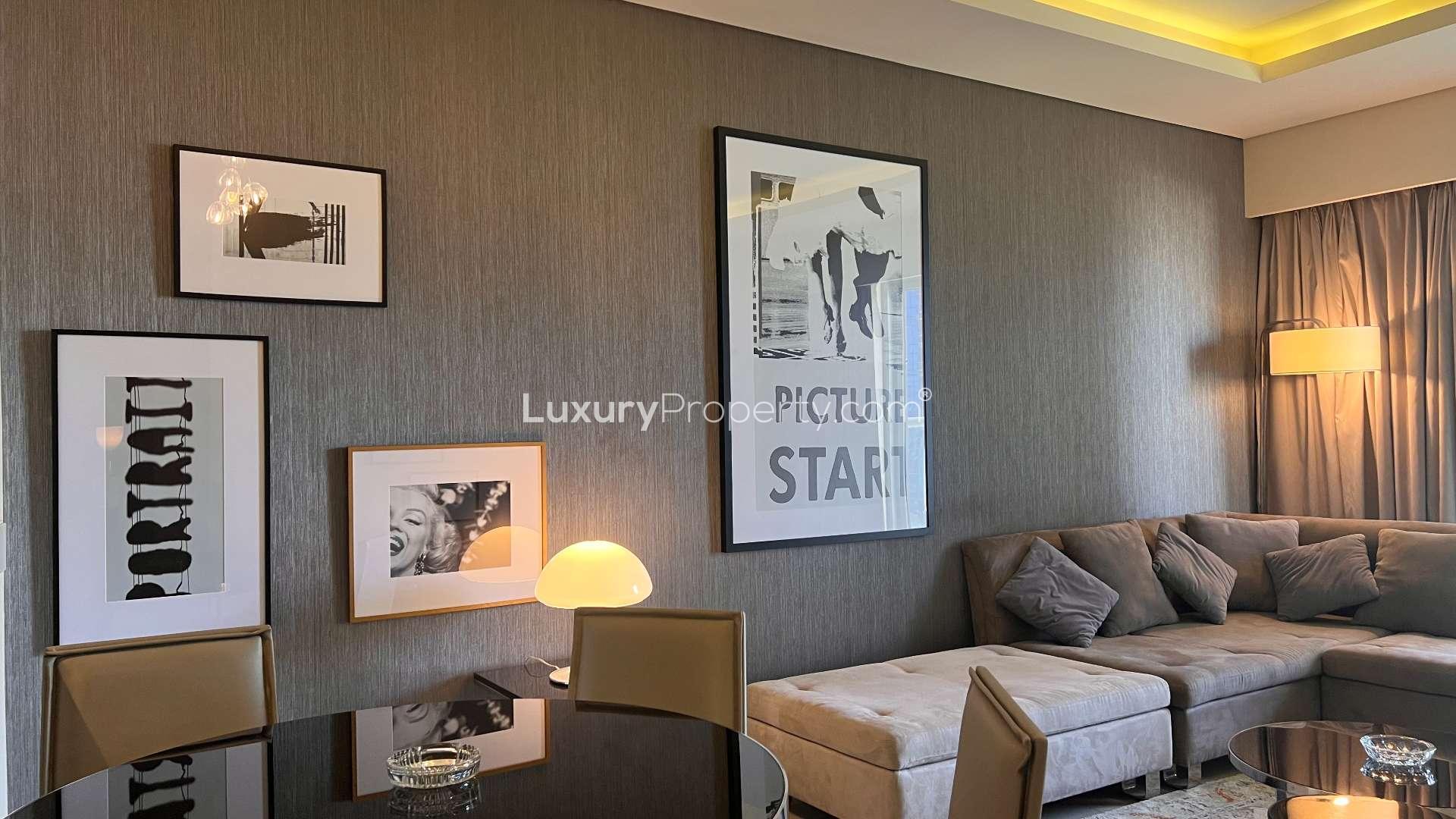 Modern living room in 5-bedroom apartment, Business Bay, Dubai, with large windows and decor