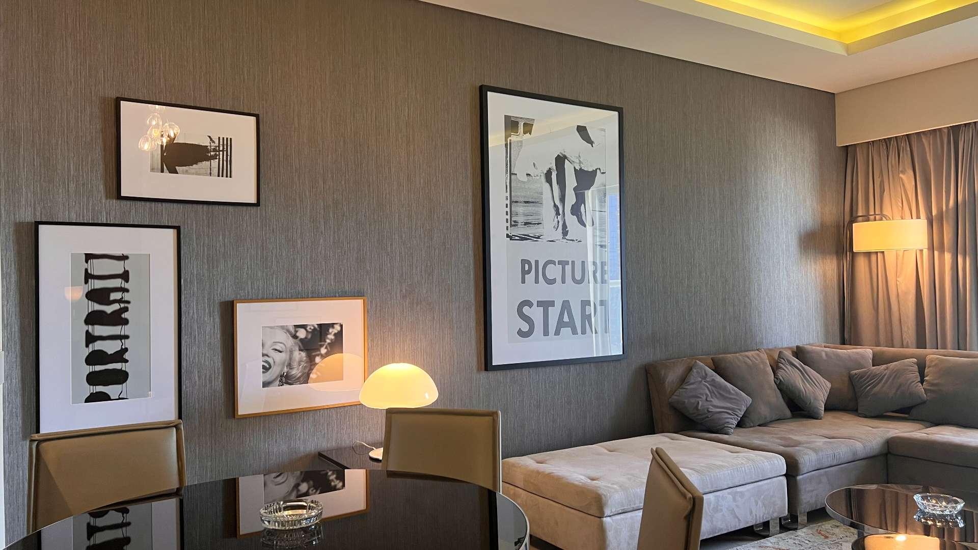 Modern living room in 5-bedroom apartment, Business Bay, Dubai, with large windows and decor