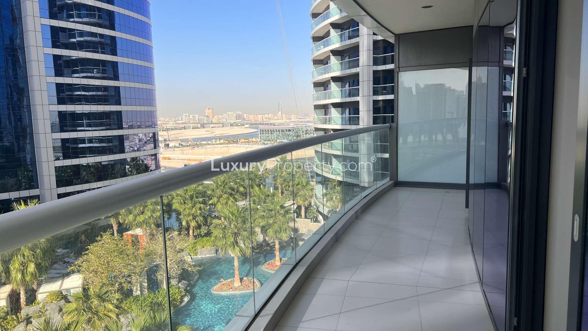 Modern living room in Business Bay apartment, featuring stylish decor and large windows