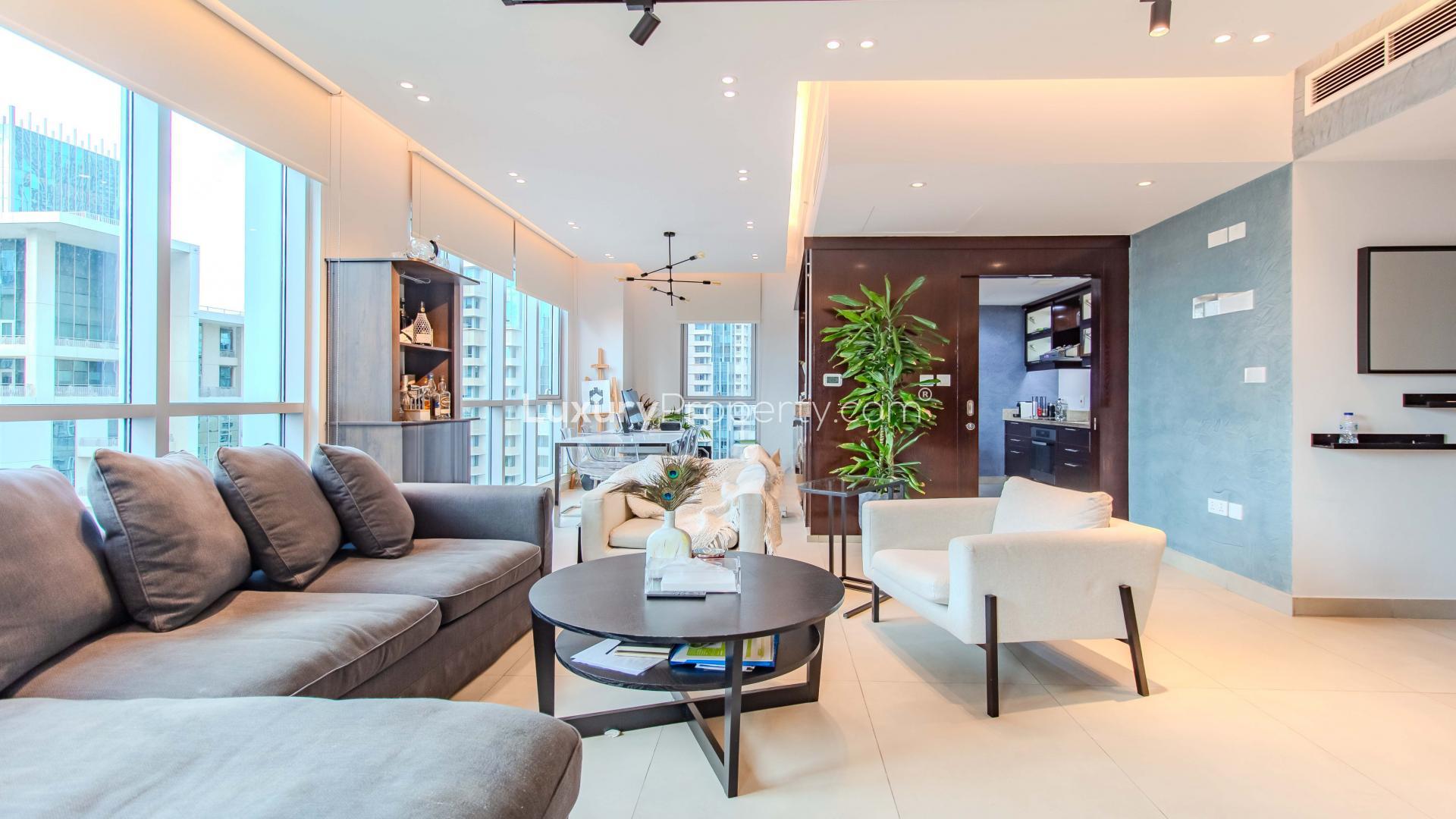 Renovated high-floor apartment living room with modern decor, Downtown Dubai, available for rent