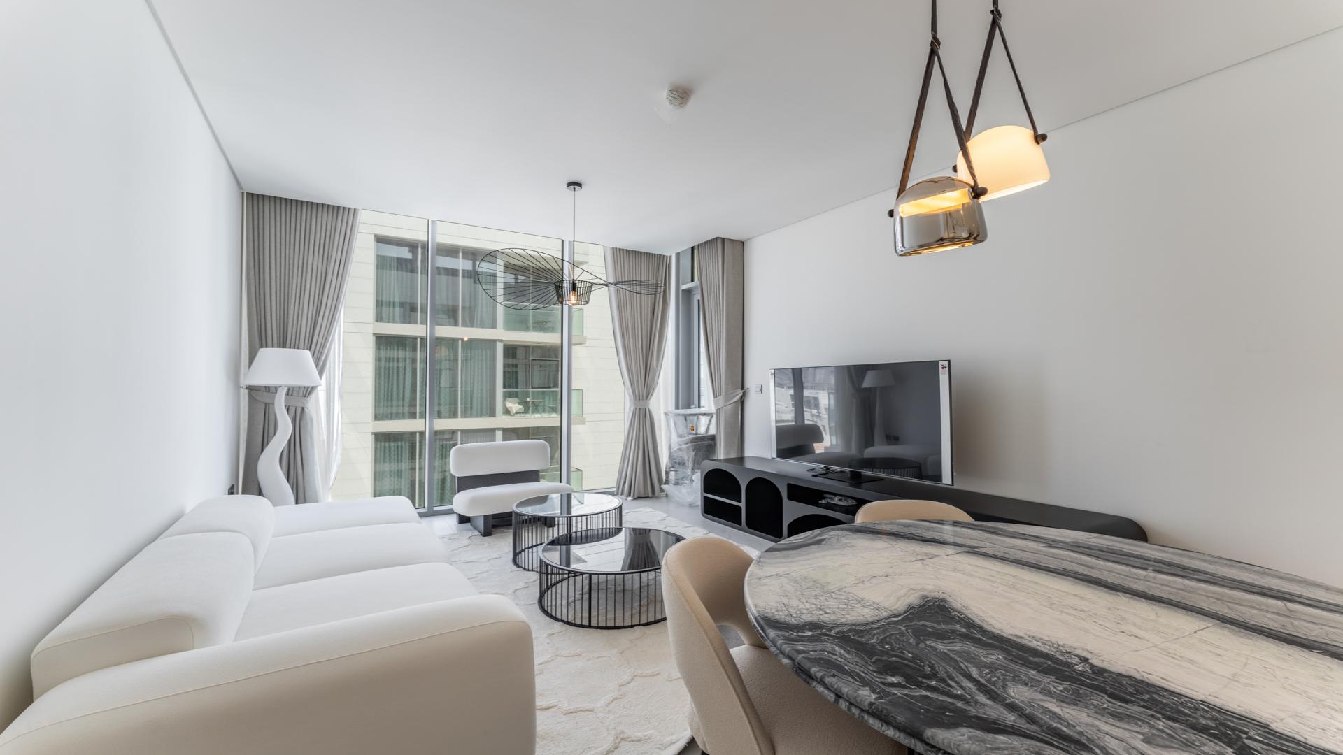 "View from 1-bedroom apartment in Residences 30, District One, overlooking pool and cityscape.",Modern living room in 1-bedroom apartment, marble finishes, Mohammed Bin Rashid City, District One