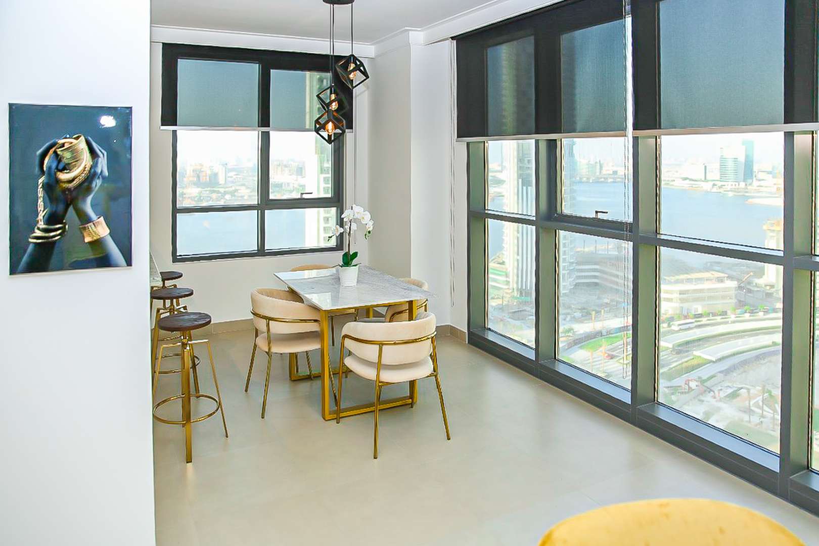 Fully furnished living room in Dubai Creek Harbour apartment, featuring modern decor and large windows