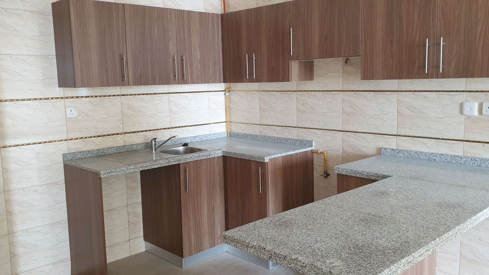Modern kitchen in 1-bedroom apartment, Dubai Star Tower, Jumeirah Lake Towers, granite countertops