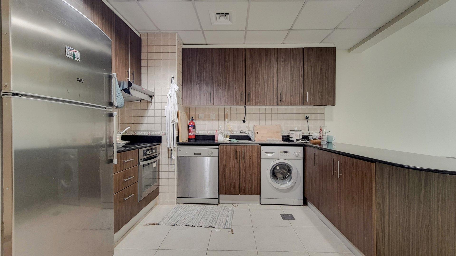 High floor apartment interior with modern kitchen and office space in Dubai Marina