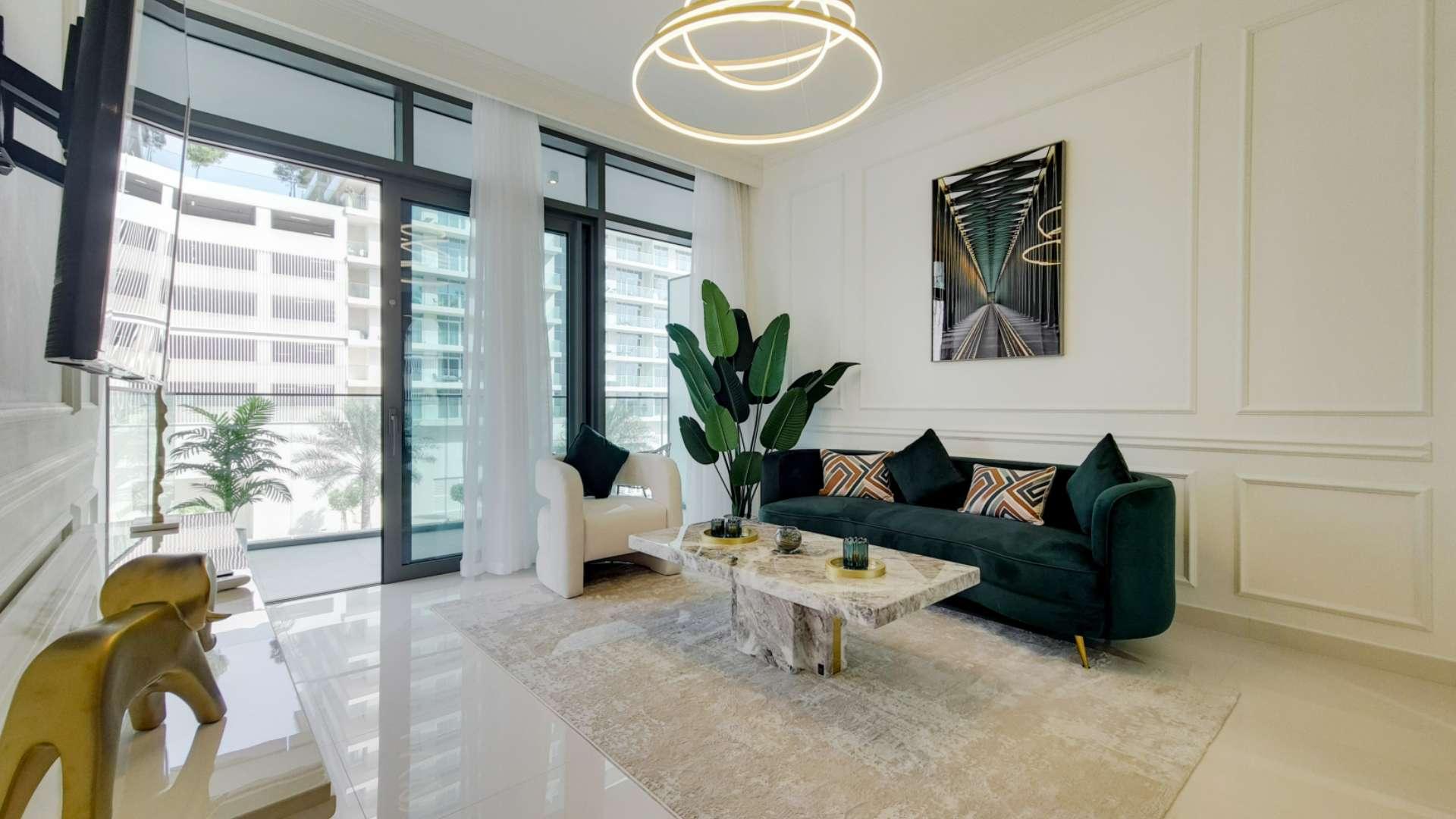 "Balcony view from furnished apartment at Emaar Beachfront, Dubai Harbour, with modern seating.",Brand new furnished apartment living room in Emaar Beachfront, Dubai Harbour, with modern decor