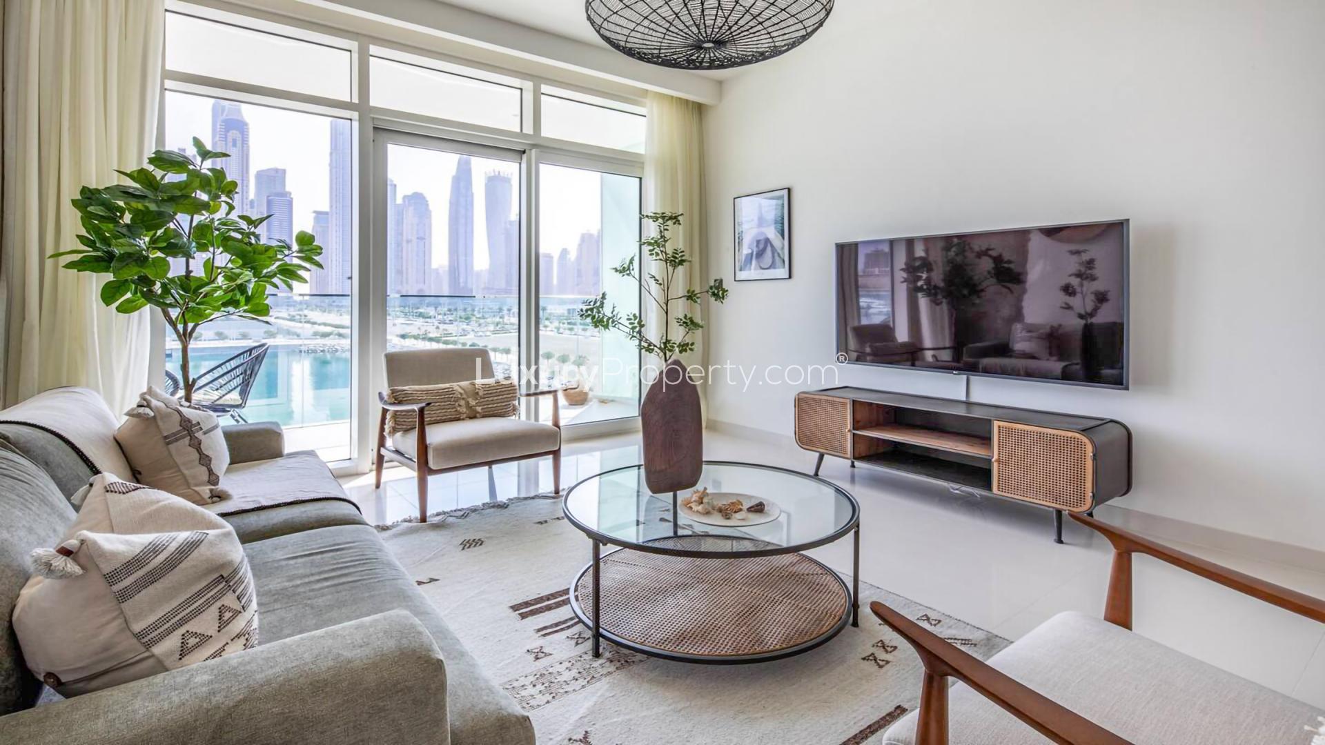 Furnished living room with Marina skyline view in Emaar Beachfront apartment, Dubai Harbour