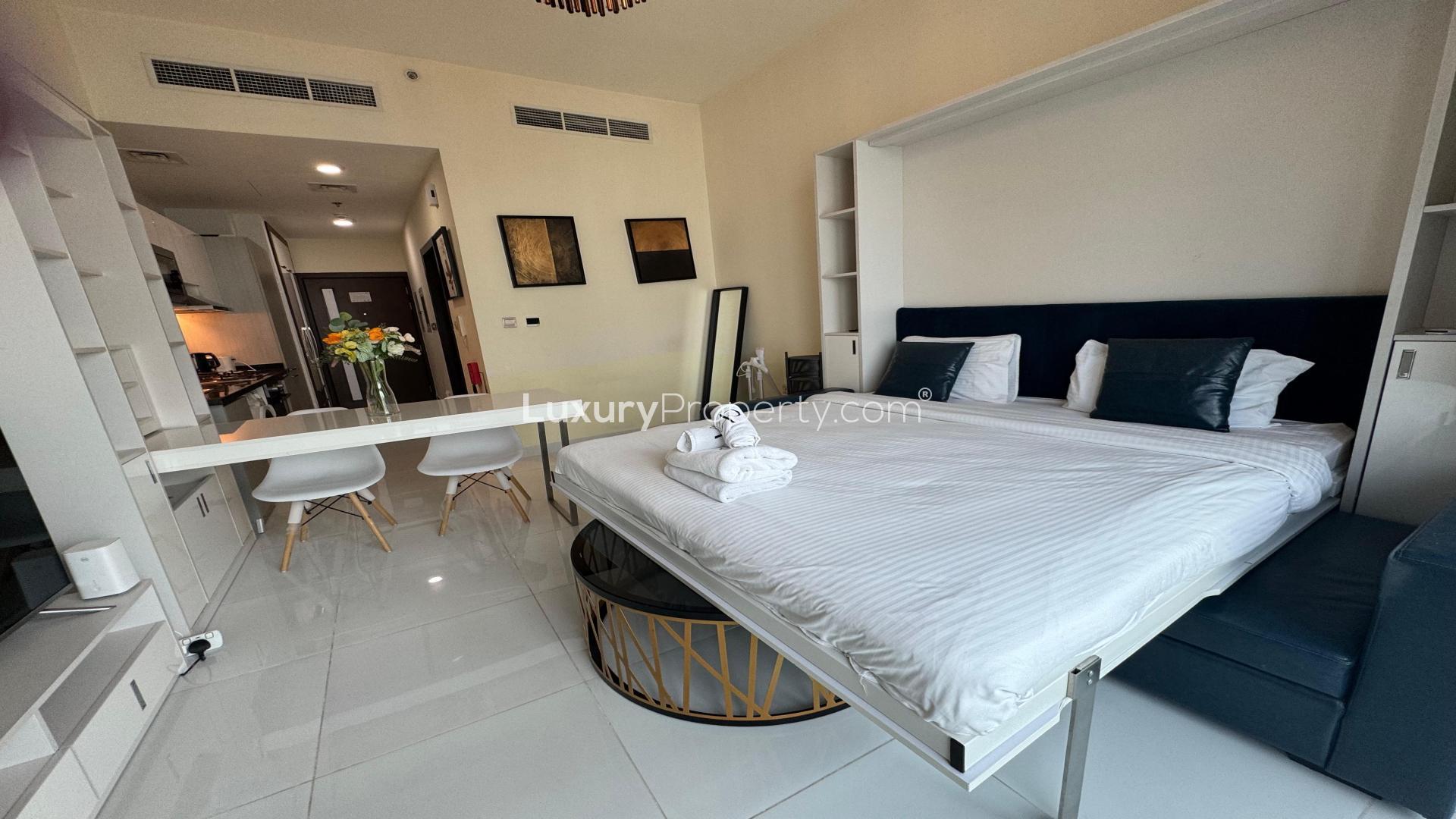 Furnished studio apartment in Miraclz Tower, Arjan, with modern decor and amenities for rent