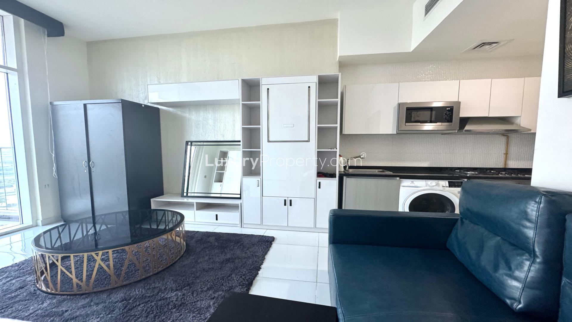 Furnished studio apartment interior in Miraclz Tower, Arjan, featuring modern decor and amenities