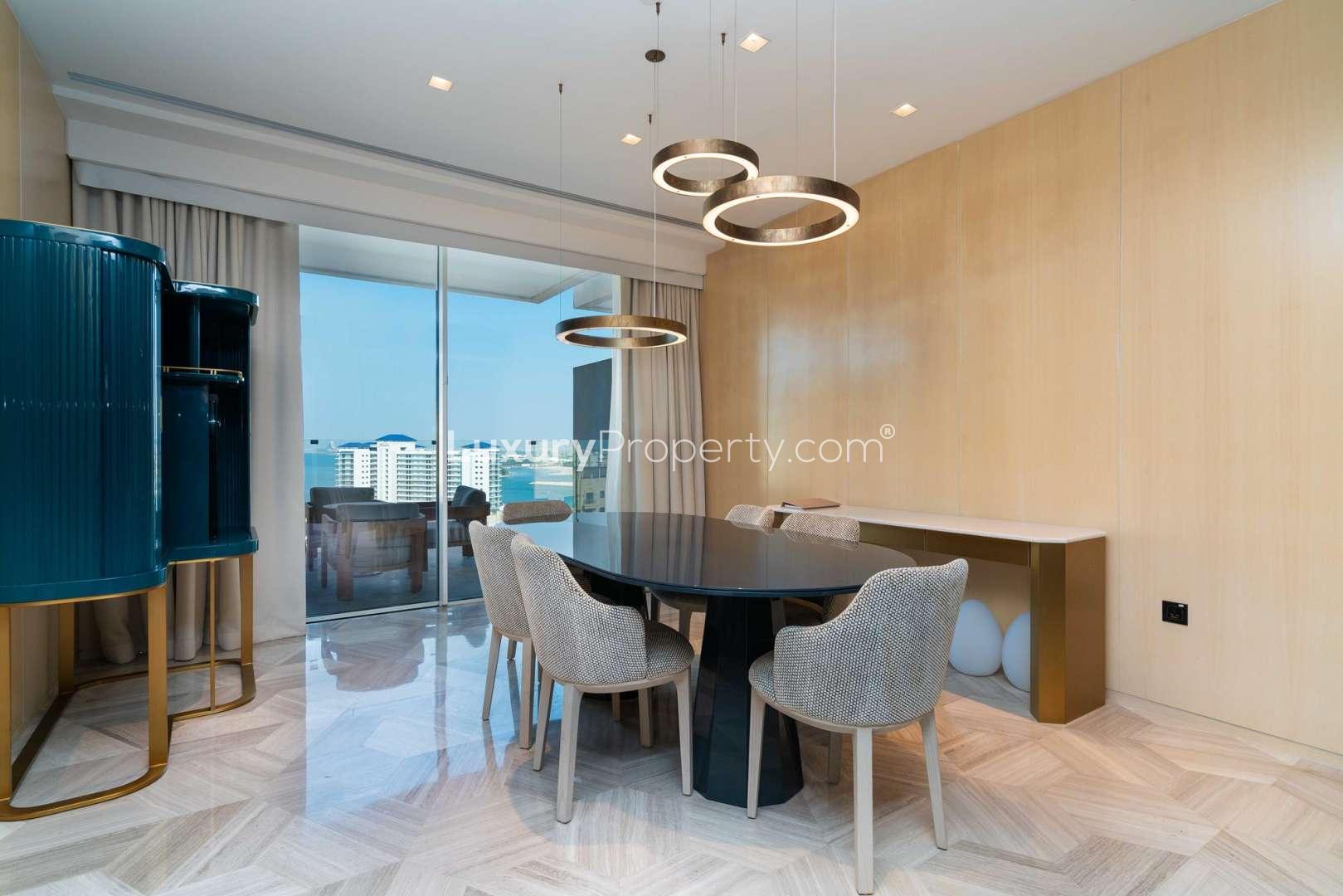 Luxury bedroom interior in resort-style apartment, Palm Jumeirah, with modern decor and furnishings