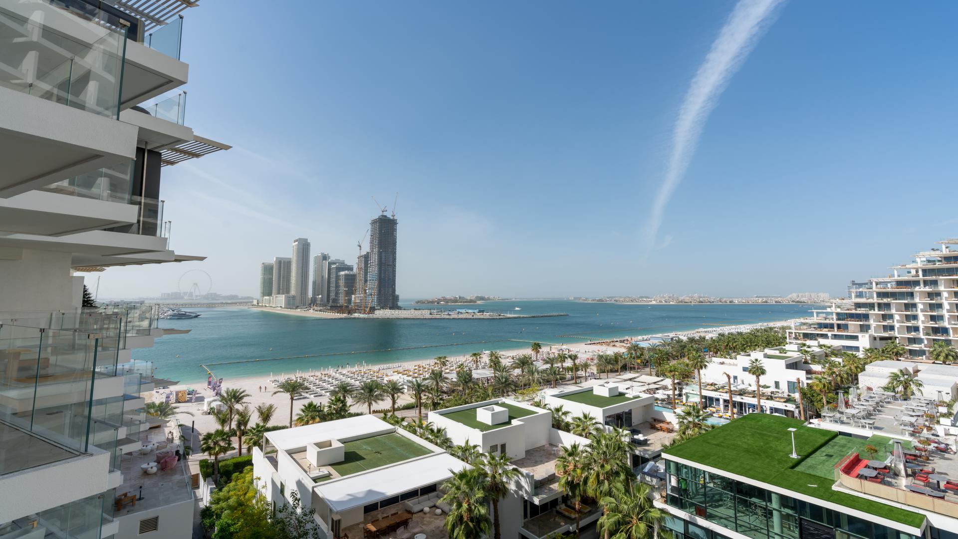 "Palm Jumeirah apartment balcony with stunning full sea views, available for rent.",Fully furnished living room with sea view in Palm Jumeirah apartment for rent