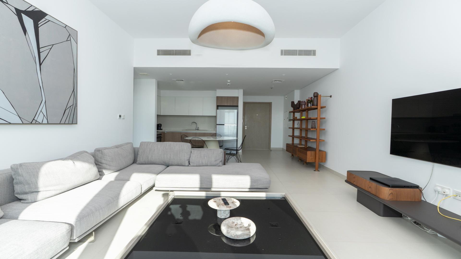 "Stunning Dubai Creek Harbour view from The Grand apartment for rent, LP47317.",Modern living room in The Grand, Dubai Creek Harbour apartment, featuring sleek furniture and decor