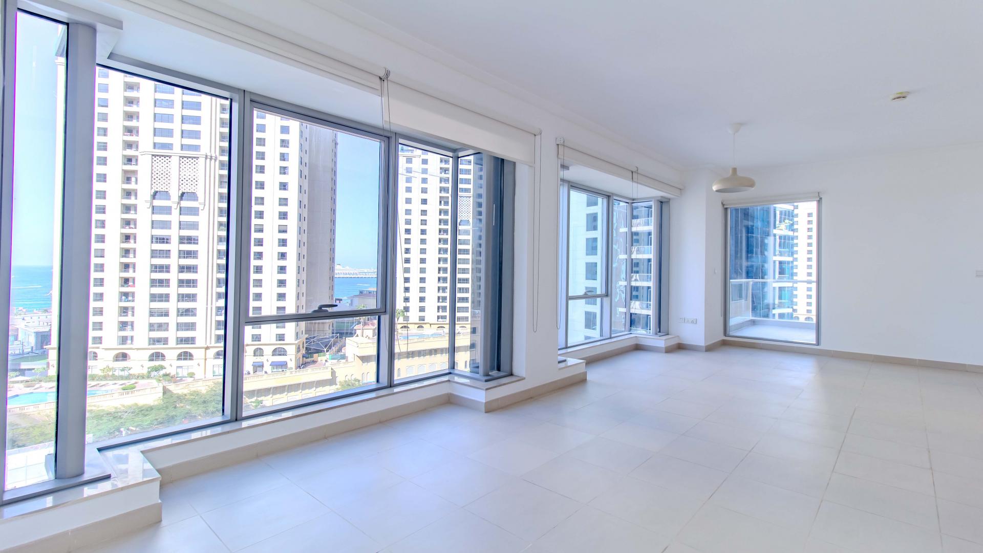 Modern bathroom in Beauport Tower apartment, Dubai Marina, featuring bathtub and large mirror
