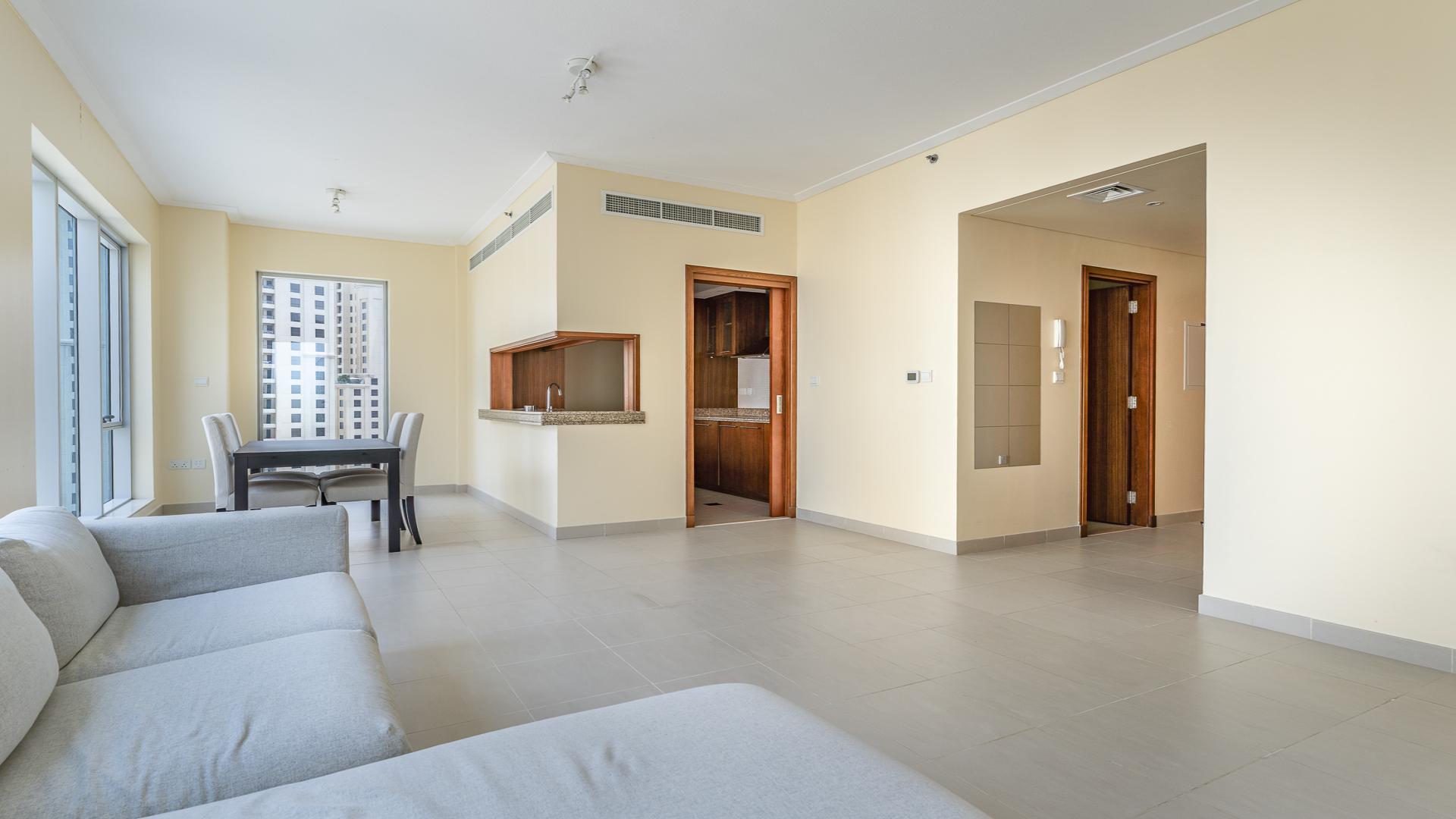 Aerial view of Shemara Tower, Dubai Marina, showcasing surrounding buildings and roads