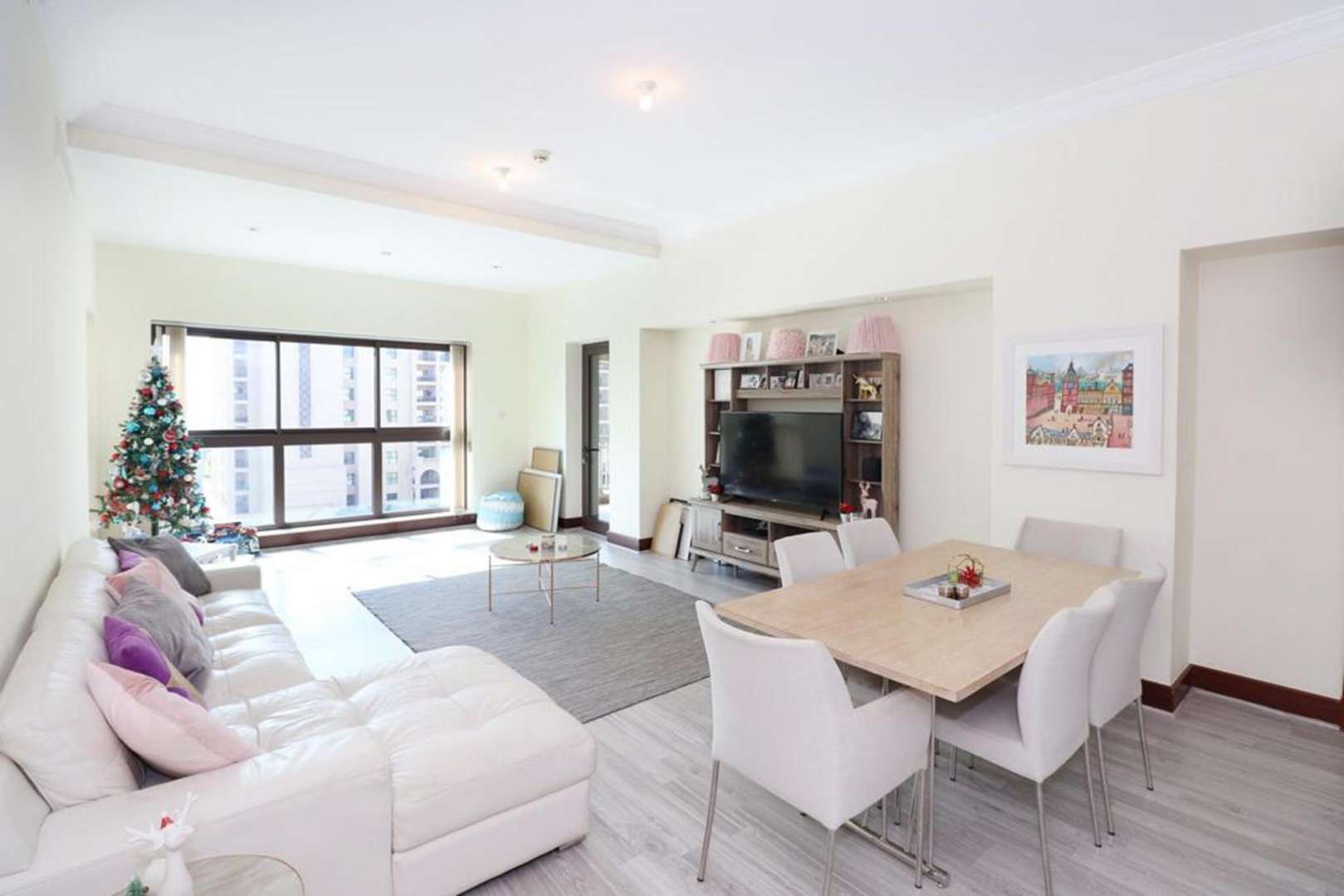 Spacious living and dining area in Palm Jumeirah apartment, featuring modern decor and large windows