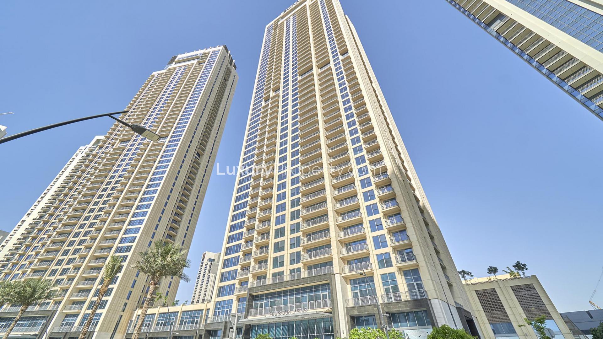 Elegant living room with large windows in Dubai Creek Harbour apartment for rent