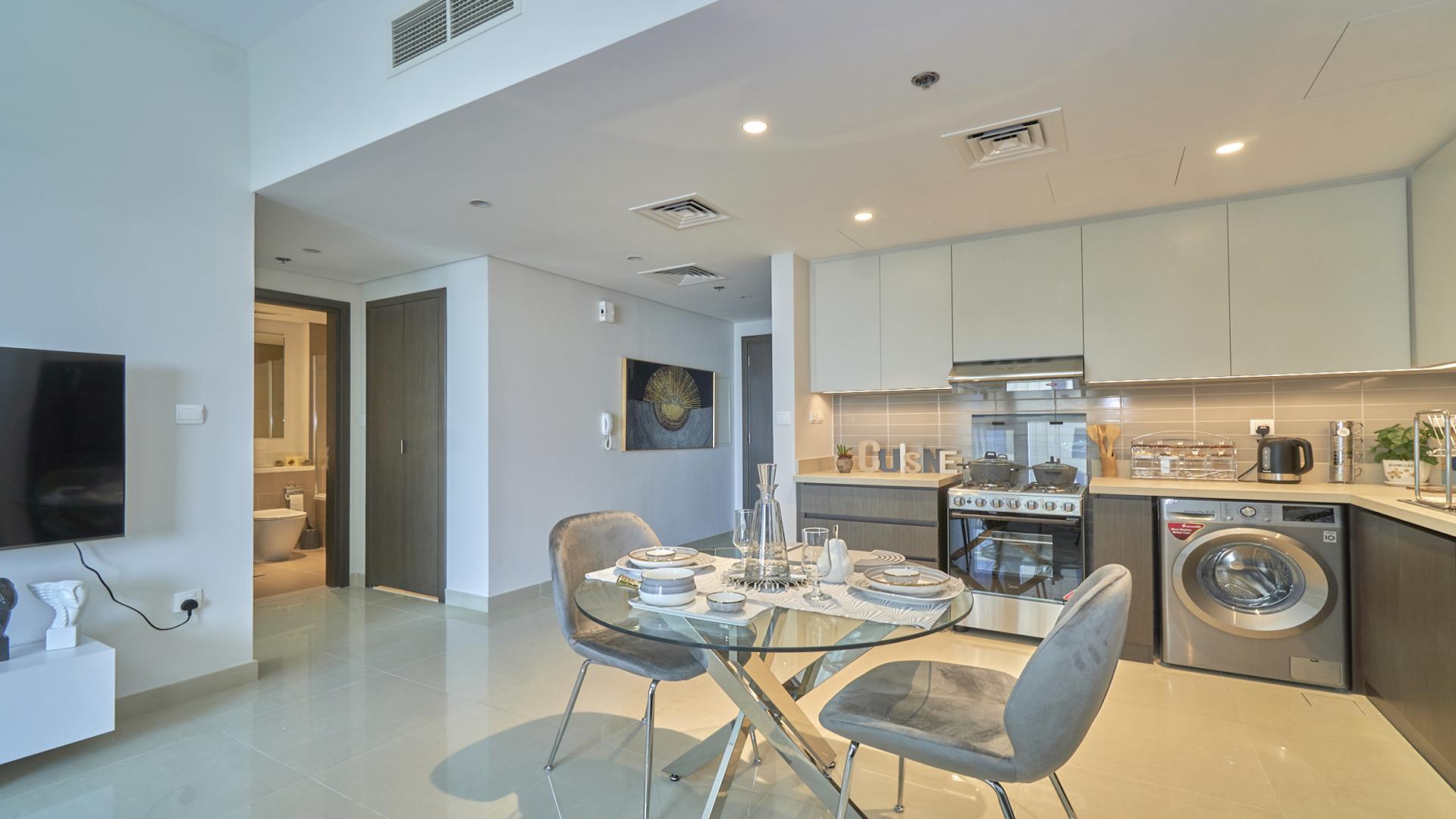 Furnished living area and kitchen in 1-bedroom apartment, Harbour Views, Dubai Creek Harbour