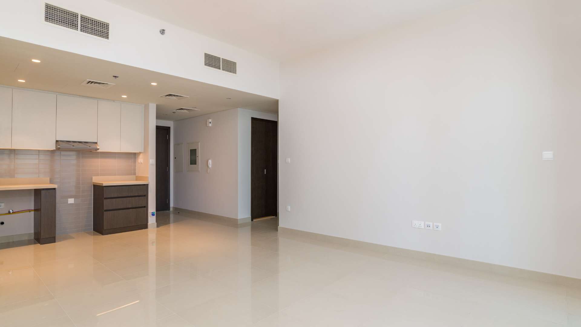 Cozy 1-bedroom apartment interior with balcony view in Dubai Creek Harbour for rent