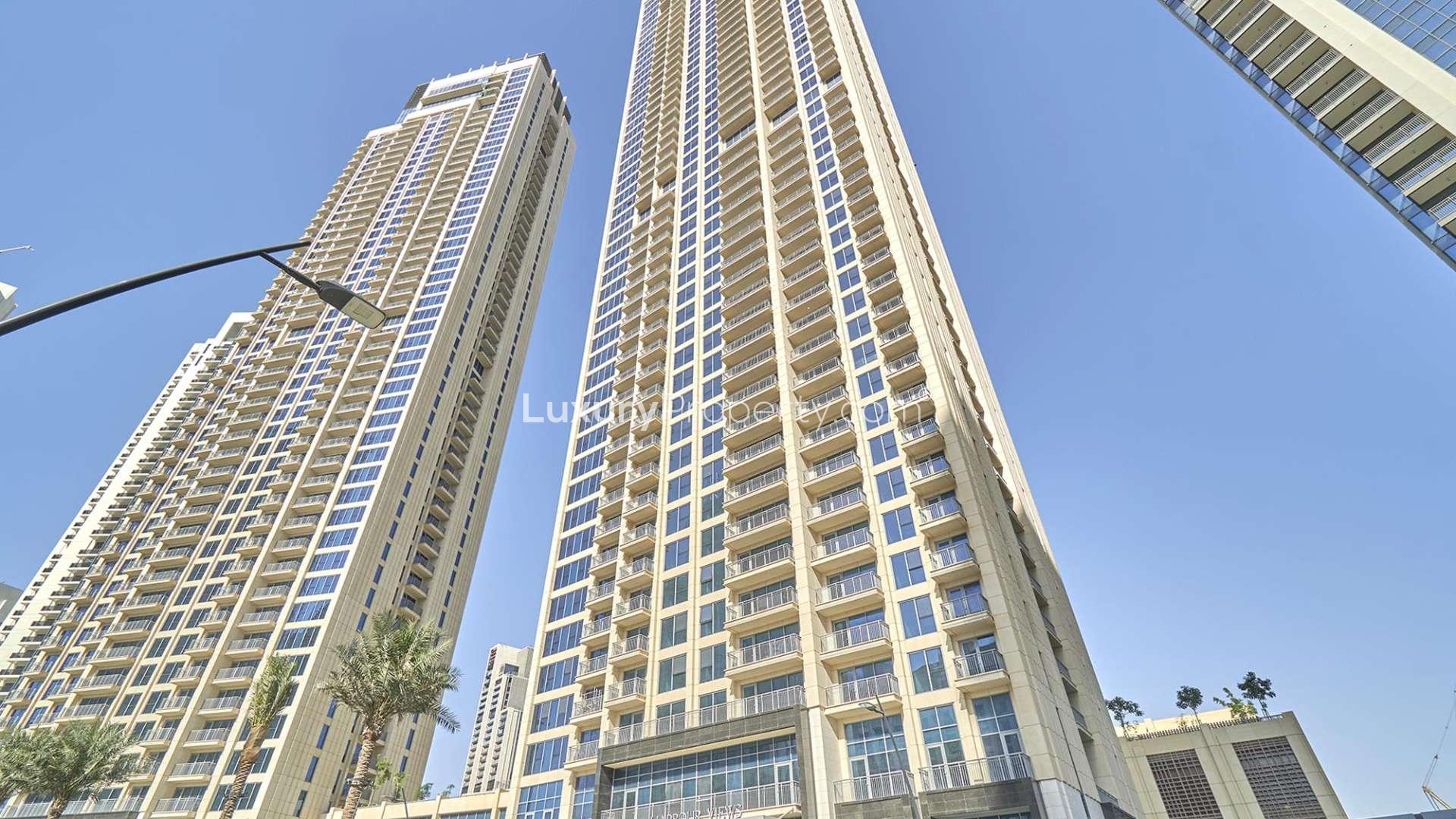 Spacious living room with floor-to-ceiling windows in Dubai Creek Harbour apartment for rent