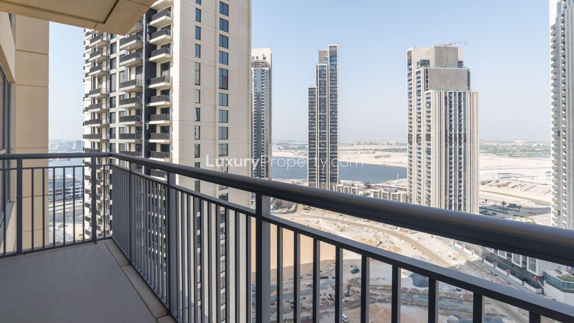 Empty living room with large windows in Harbour Views 2, Dubai Creek Harbour apartment