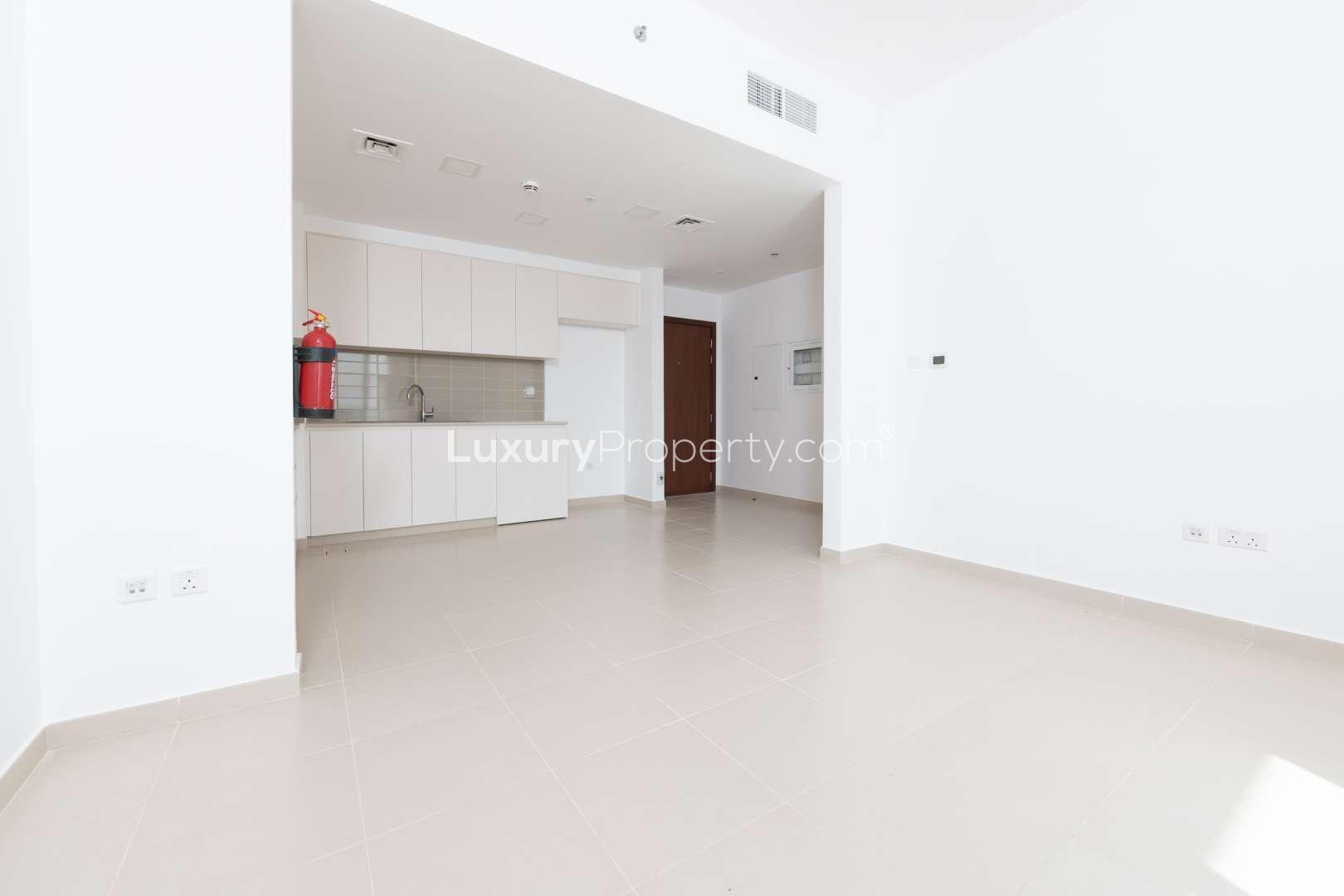 Bright bedroom with large windows and built-in closet in Hayat Boulevard apartment