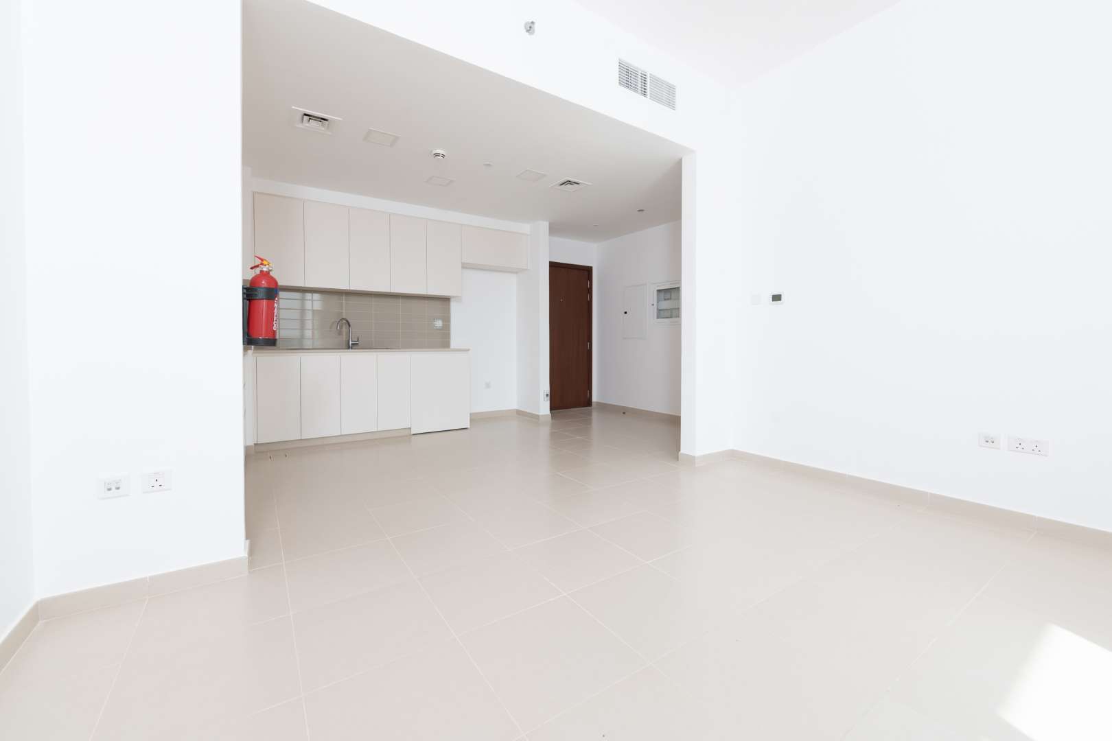 Bright bedroom with large windows and built-in closet in Hayat Boulevard apartment