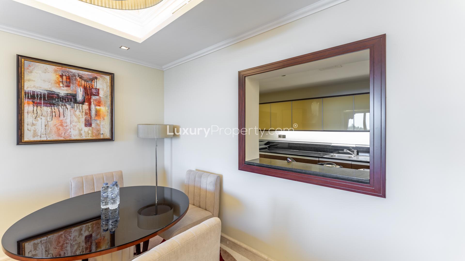 Upgraded living room in Grandeur Residences apartment, Palm Jumeirah, with modern decor and lighting